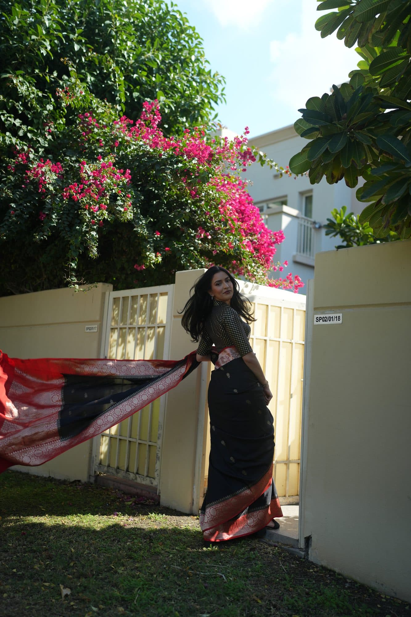 Full length, against the bougainvillea